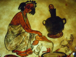 Dipinto di una donna etiope mentre cucina injera